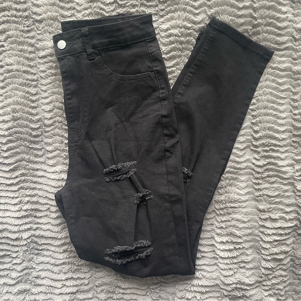 Distressed “Buckle” Jeans